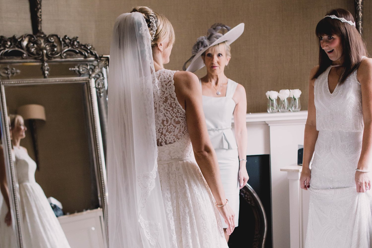 Bridal prep at a luxury wedding at Carlowrie Castle. Bride wearing Caroline Castigliano photo