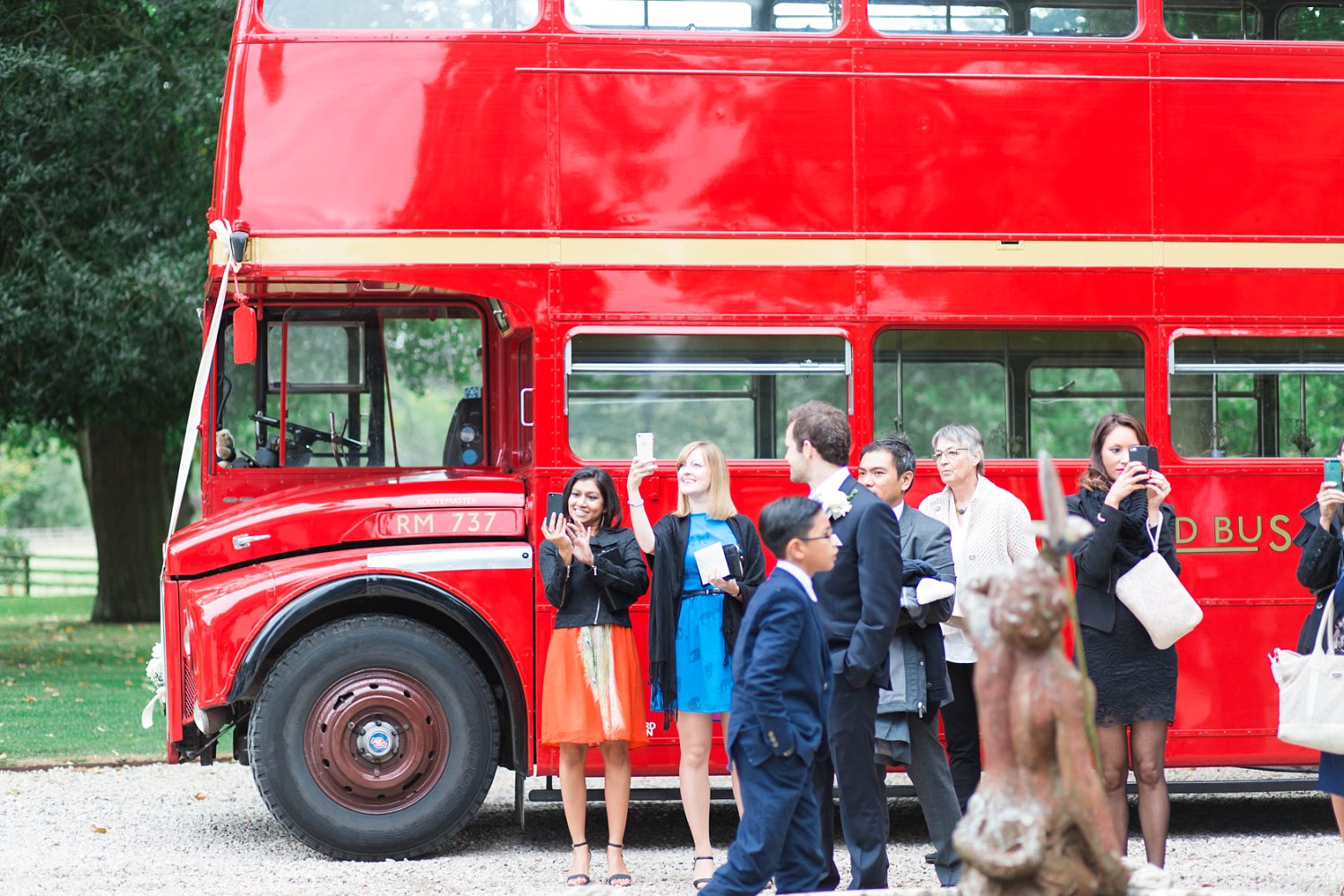 Red London Bus at a luxury wedding at Carlowrie Castle, Edinburgh photo