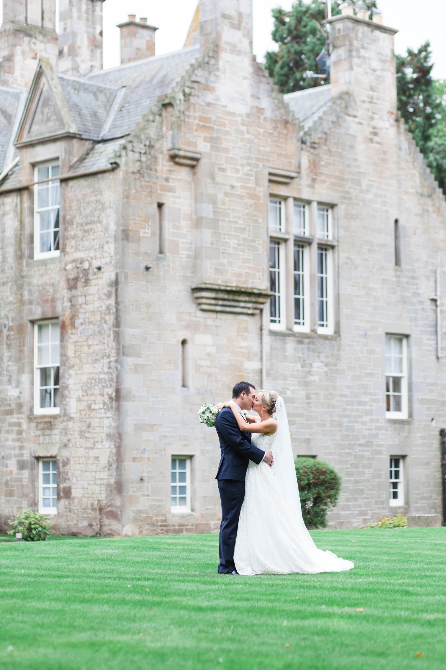 Bridal prep at a luxury wedding at Carlowrie Castle. Bride wearing Caroline Castigliano photo